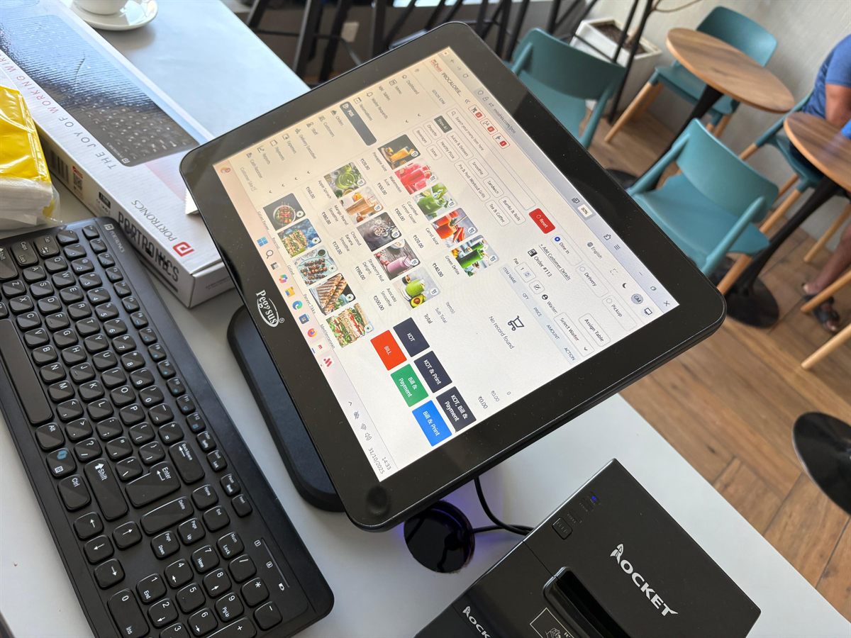 MealNix POS terminal in use on a cafe service counter