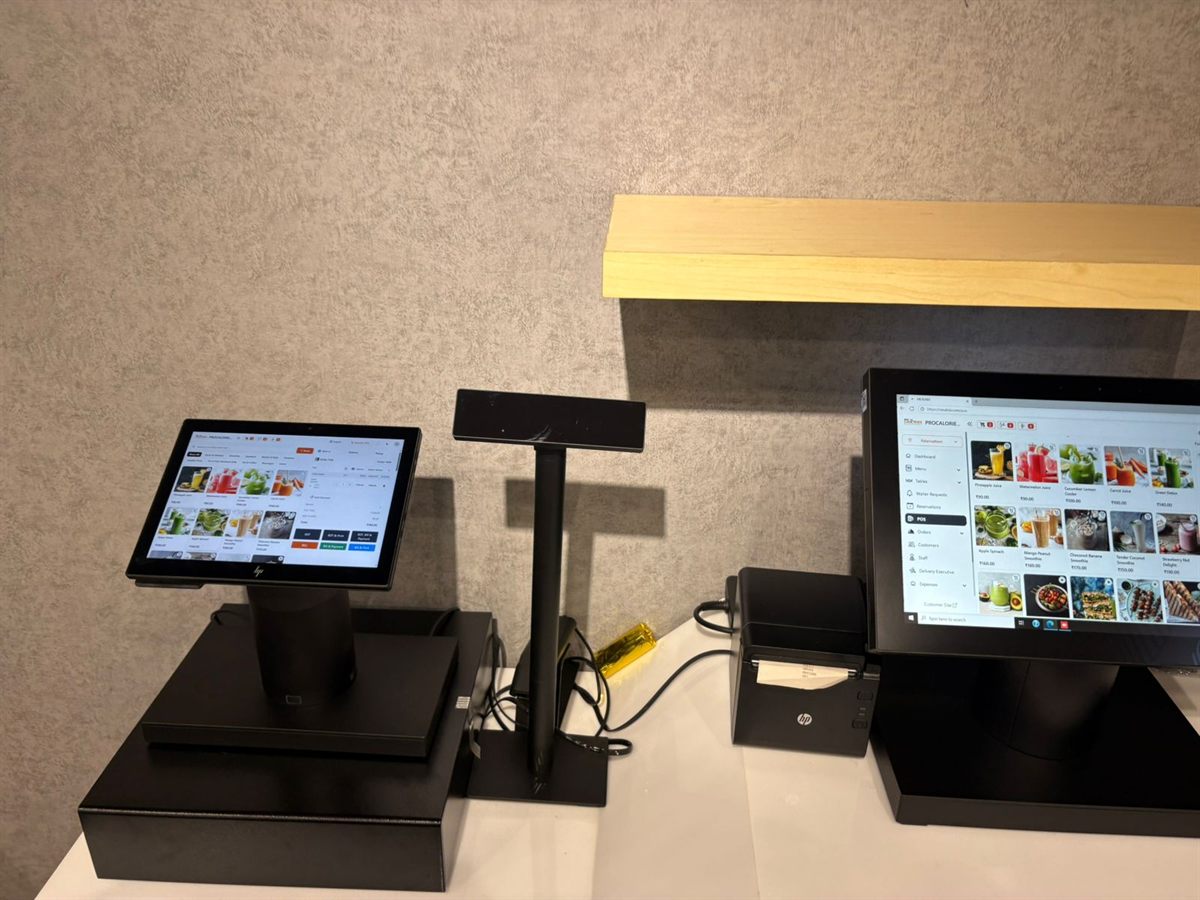 Restaurant counter with a customer display, pole display, printer and MealNix POS terminal
